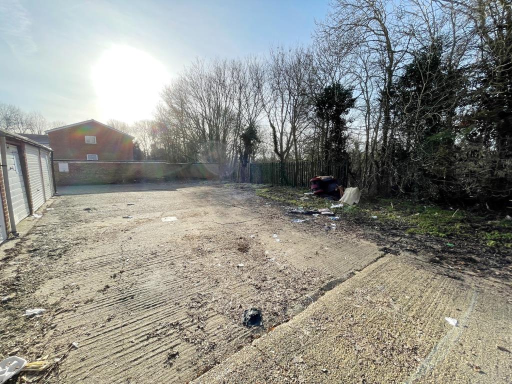 Lot: 121 - PARCEL OF LAND WITH PLANNING FOR TWO GARAGES AND NINE BOLLARD PARKING SPACES - Alternative view of Land with planning for 2 garages in London Colney going to auction